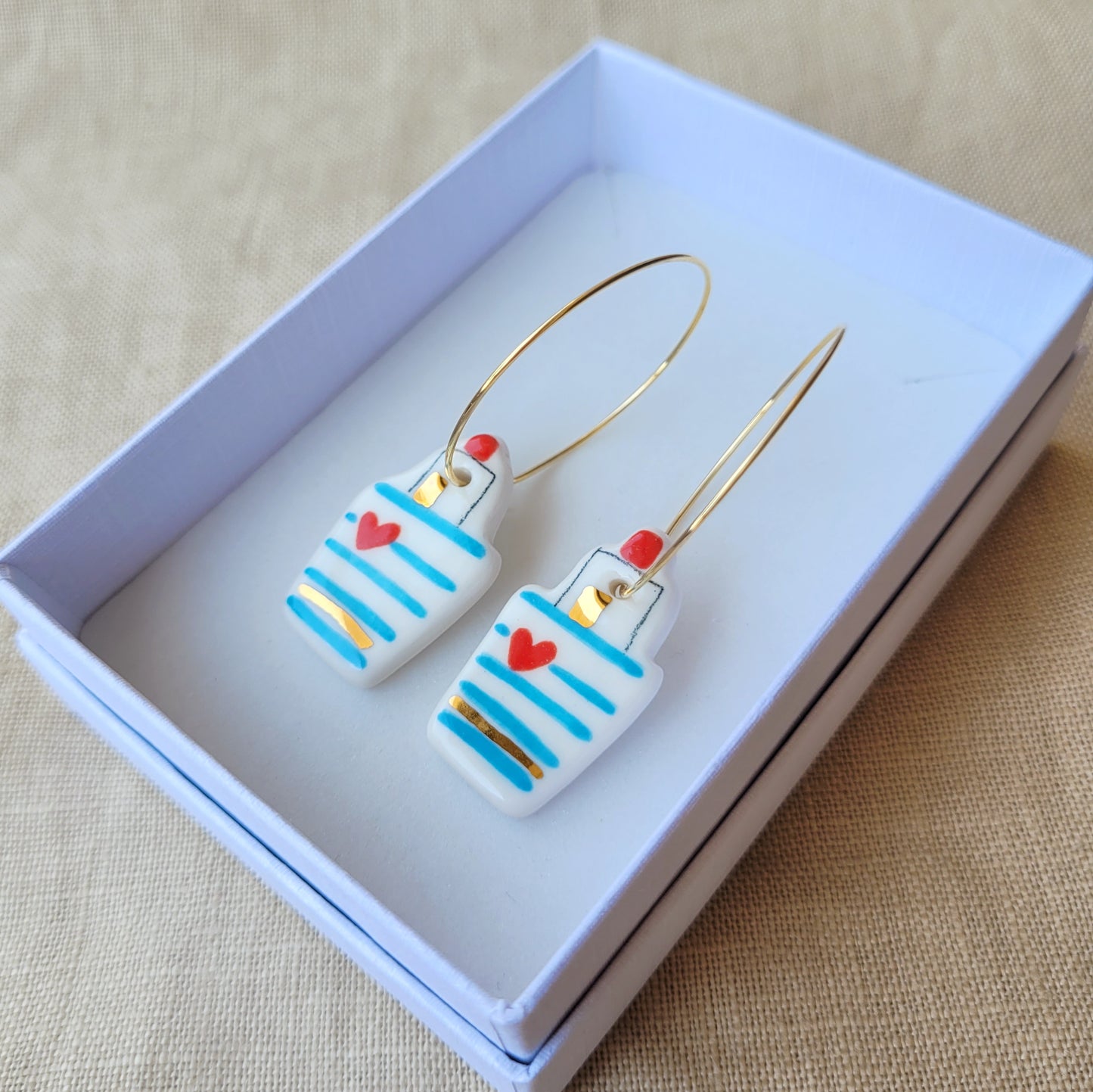 Porcelain dangle earrings with gold "Little boats with hearts"