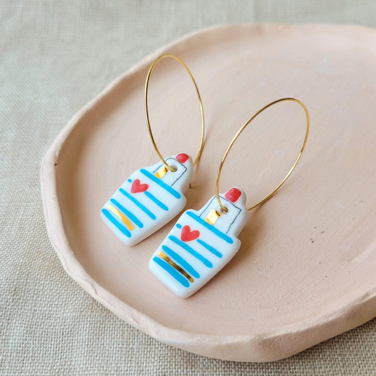 Porcelain dangle earrings with gold "Little boats with hearts"