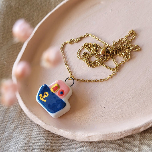 Porcelain necklace with gold "Dark blue boat"