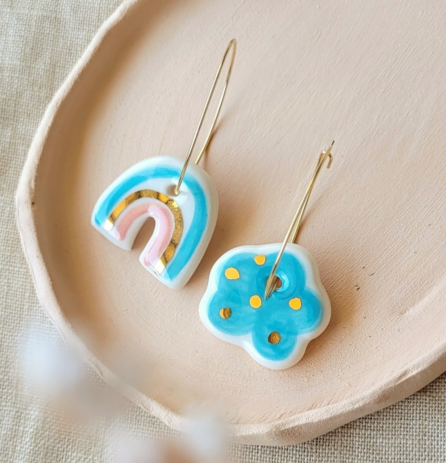 Porcelain dangle earrings with gold "Light blue cloud and rainbow with pink"