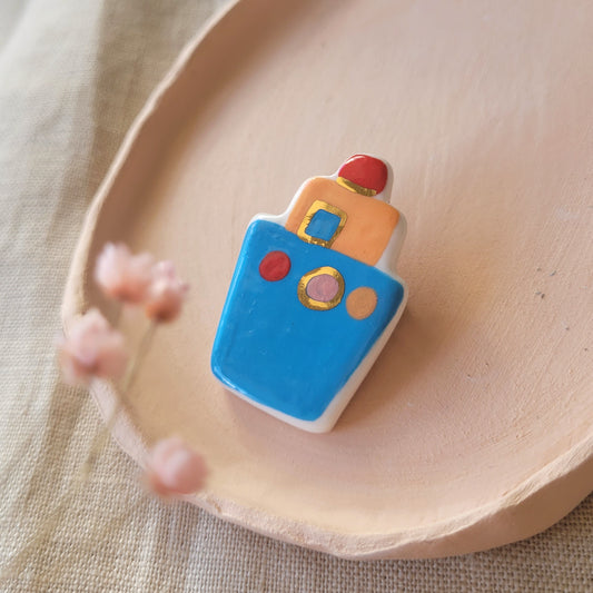 Porcelain brooch with gold "Blue boat"