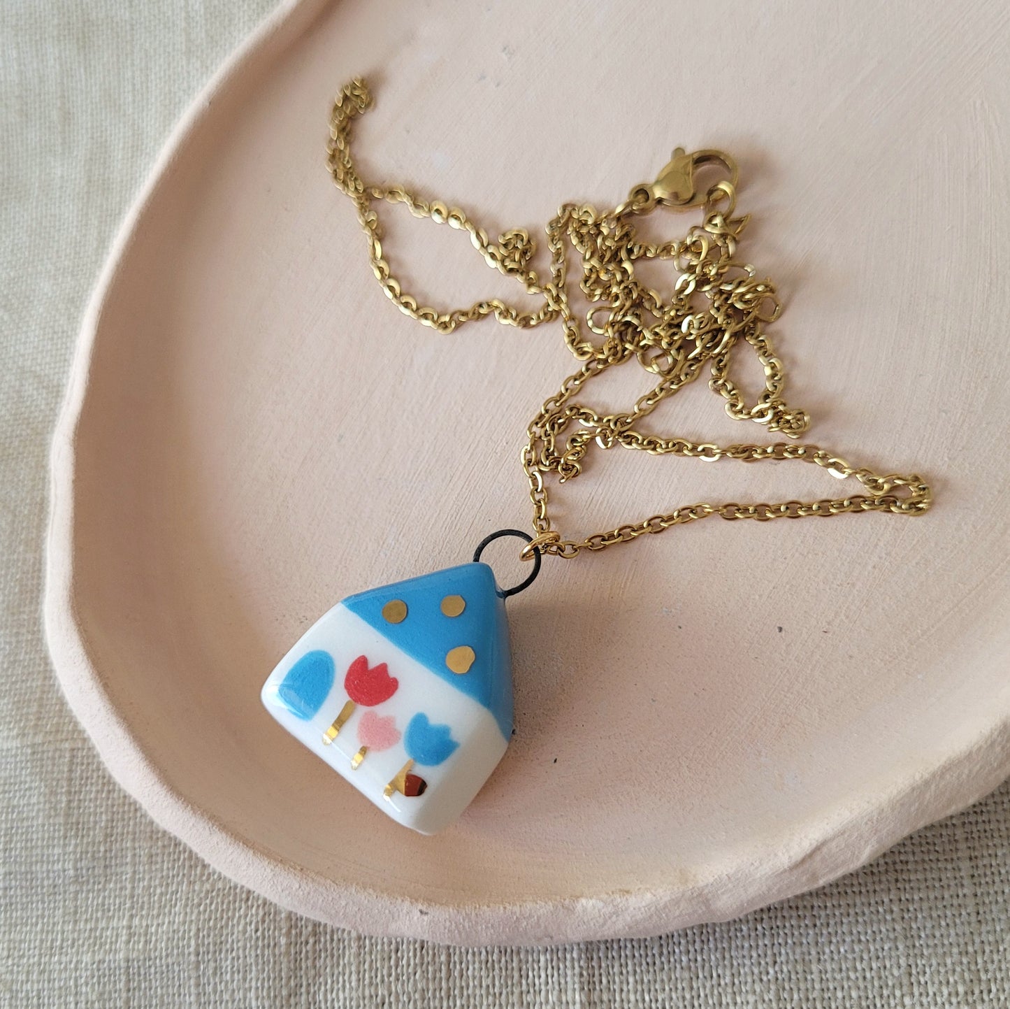 Porcelain necklace with gold "Blue house"