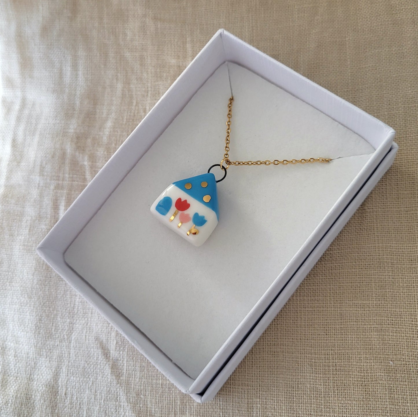Porcelain necklace with gold "Blue house"