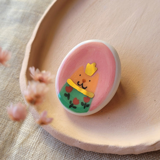 Porcelain brooch with gold "Cat with green dress"