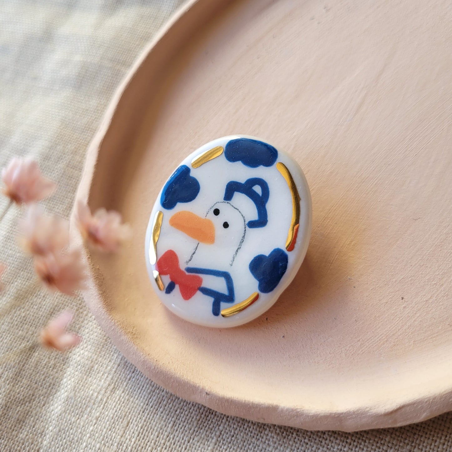 Porcelain brooch with gold "Seagull"