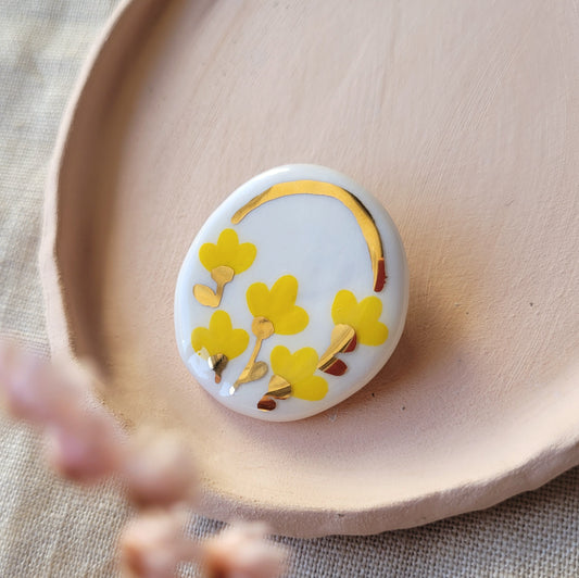 Porcelain brooch with gold "Yellow flowers"