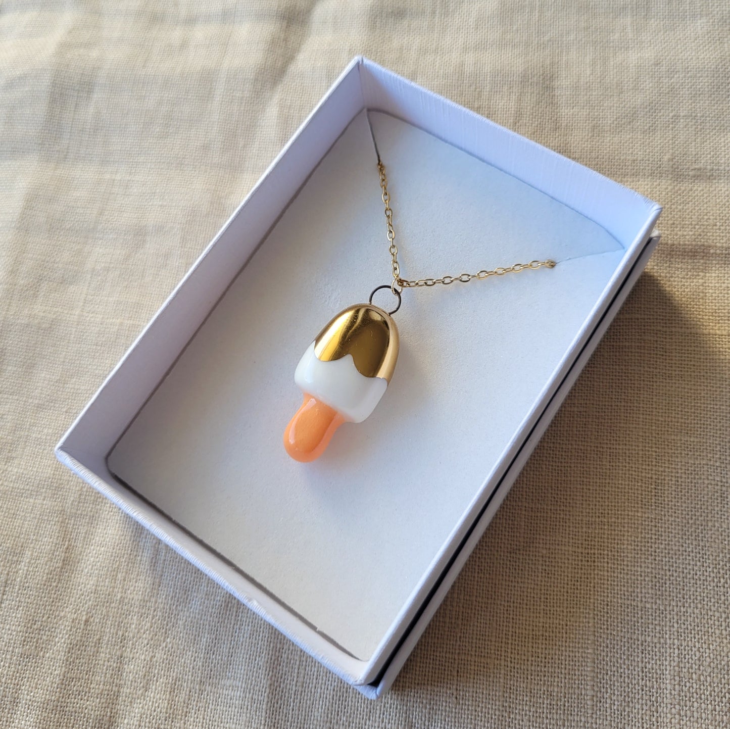 Porcelain necklace with gold "White ice cream"