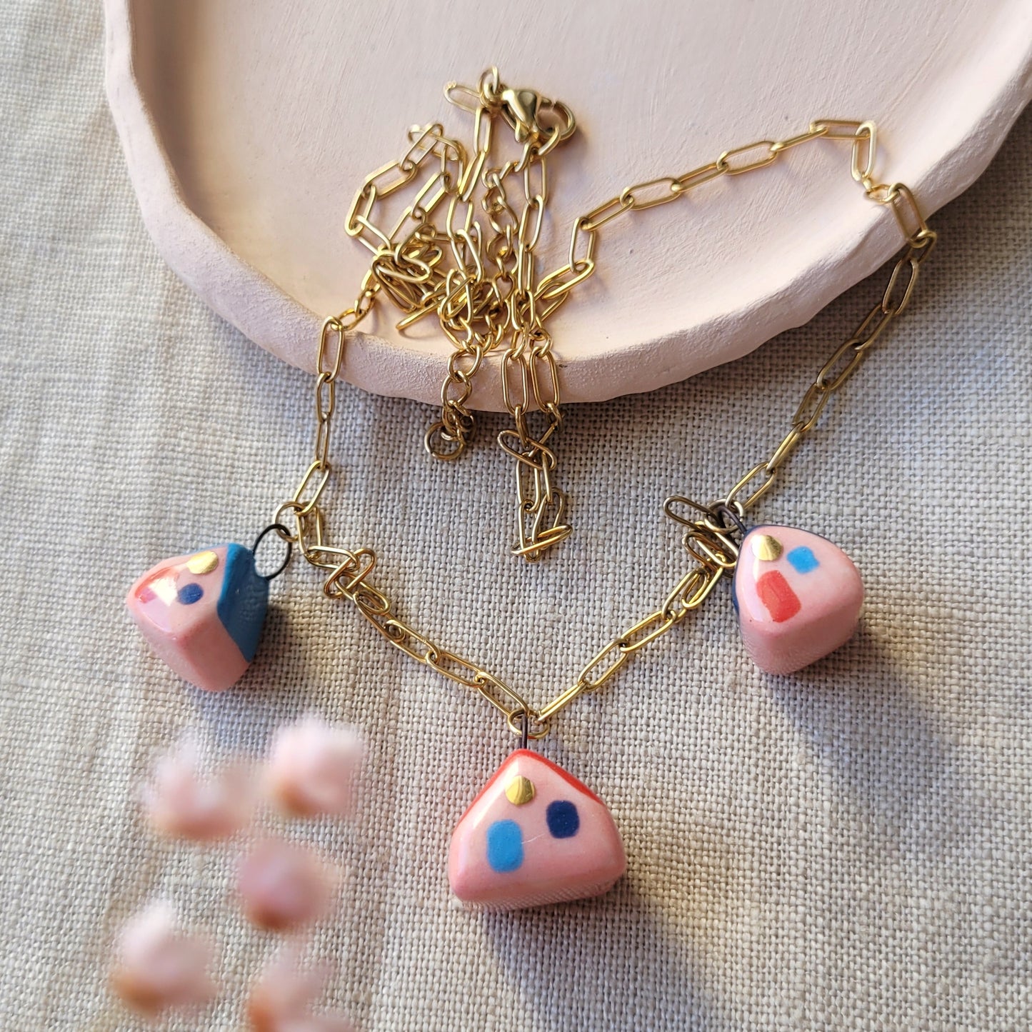 Porcelain necklace with gold "Three houses"