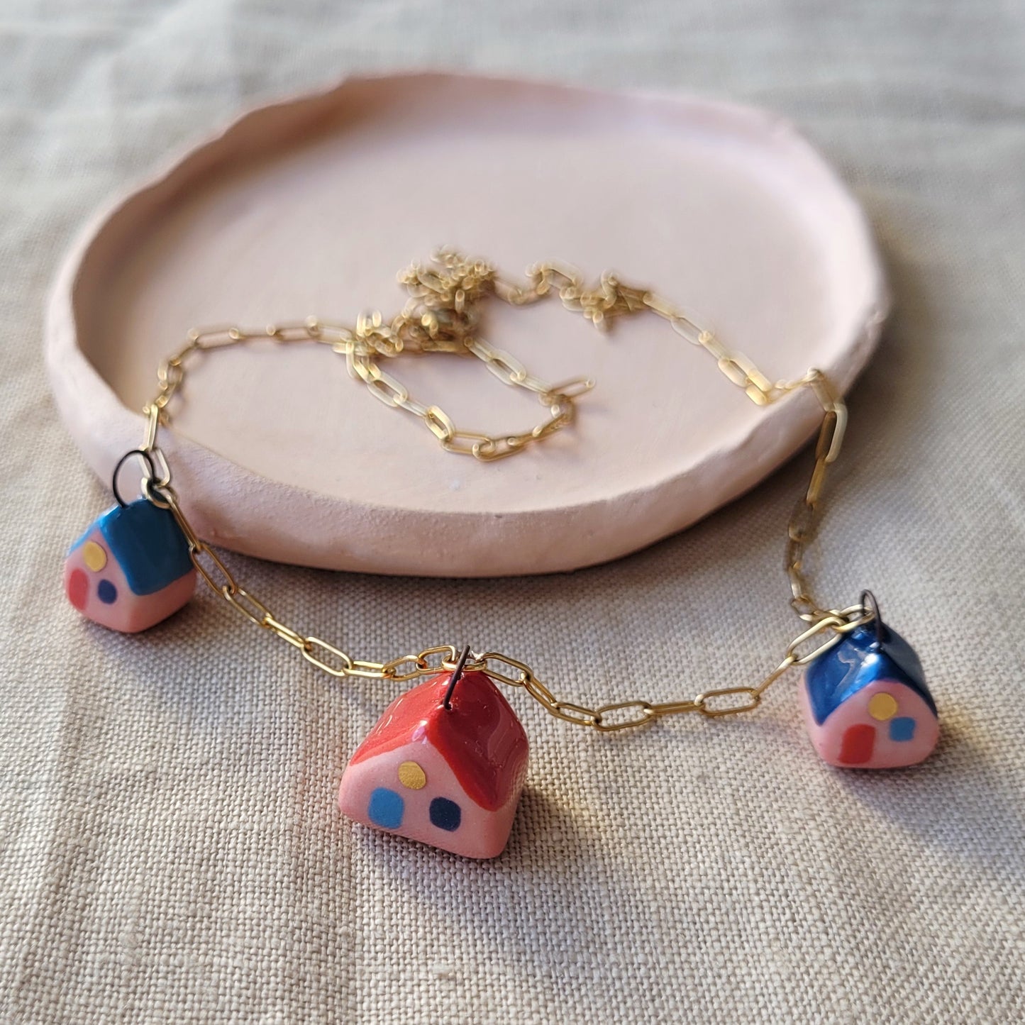 Porcelain necklace with gold "Three houses"