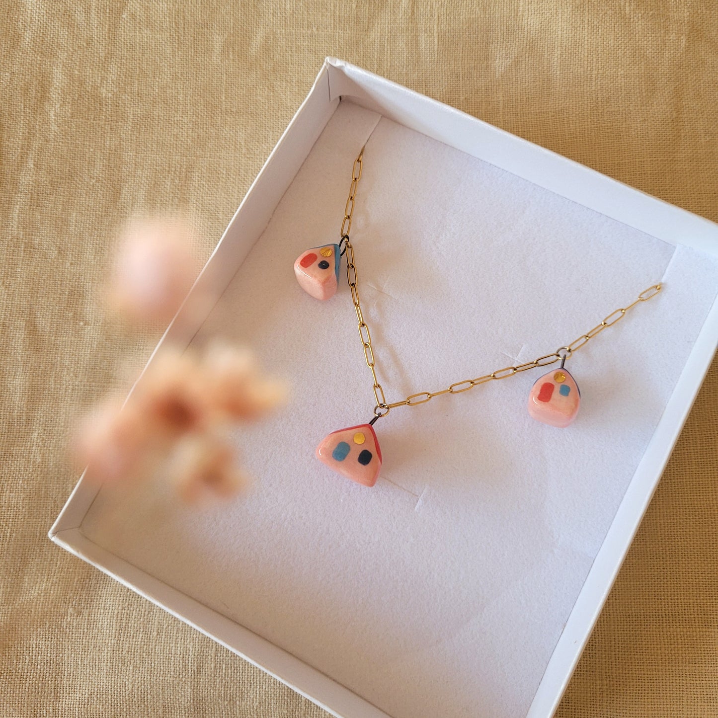 Porcelain necklace with gold "Three houses"