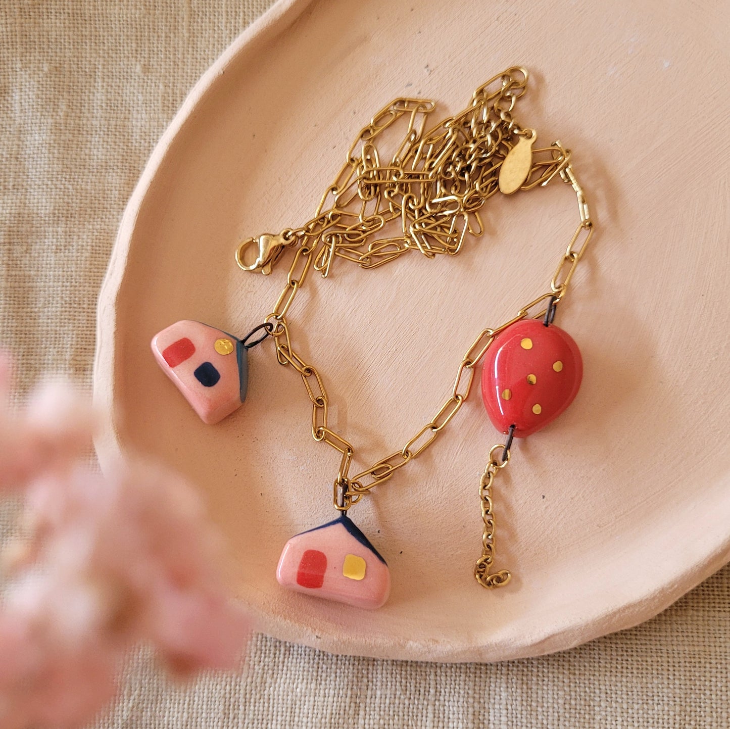 Porcelain necklace with gold "Two houses and red balloon"