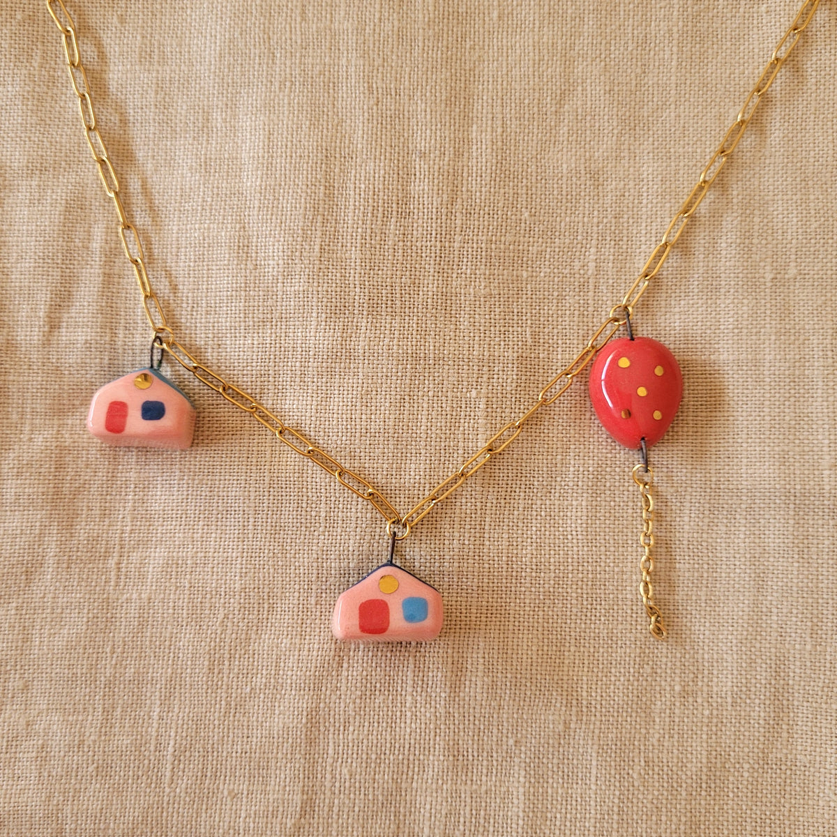 Porcelain necklace with gold "Two houses and red balloon"