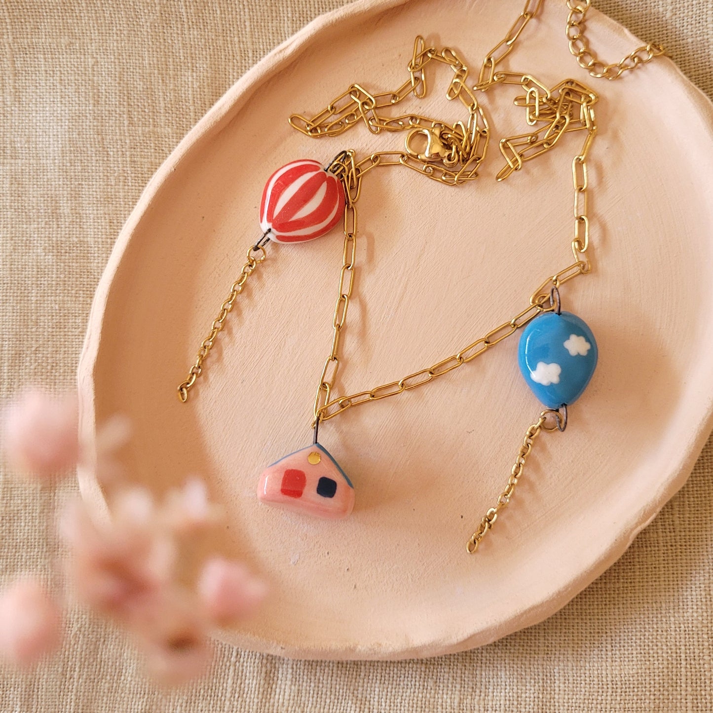 Porcelain necklace with gold "House and two balloons"