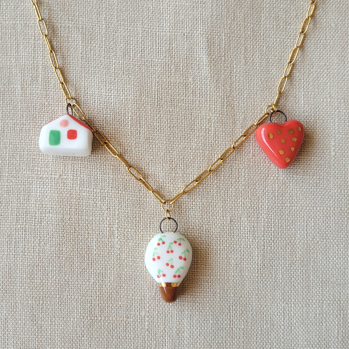Porcelain necklace with gold "Cherry tree, house and heart"