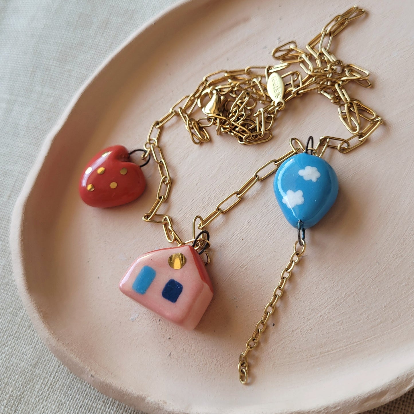 Porcelain necklace with gold "House, heart and balloon"