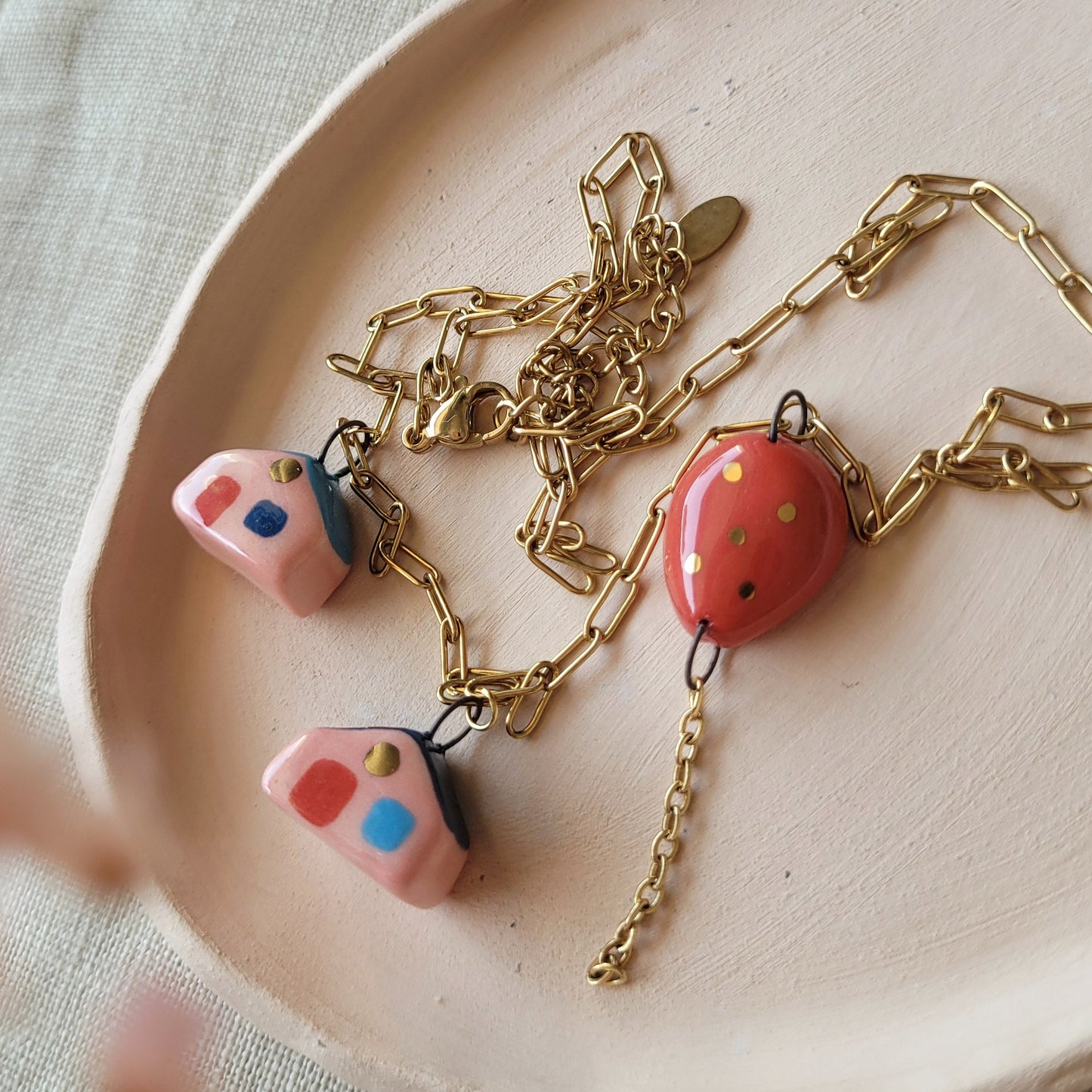 Porcelain necklace with gold "Two houses and red balloon"