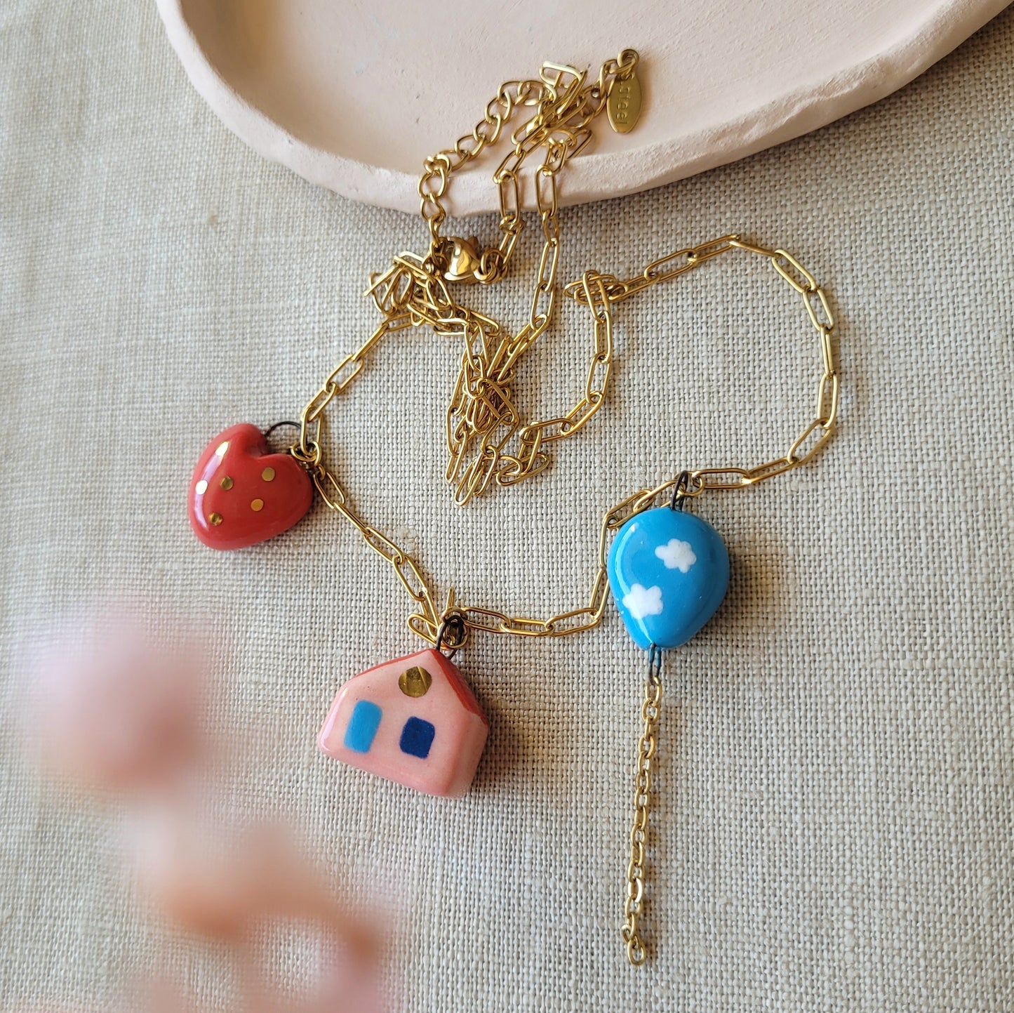 Porcelain necklace with gold "House, heart and balloon"
