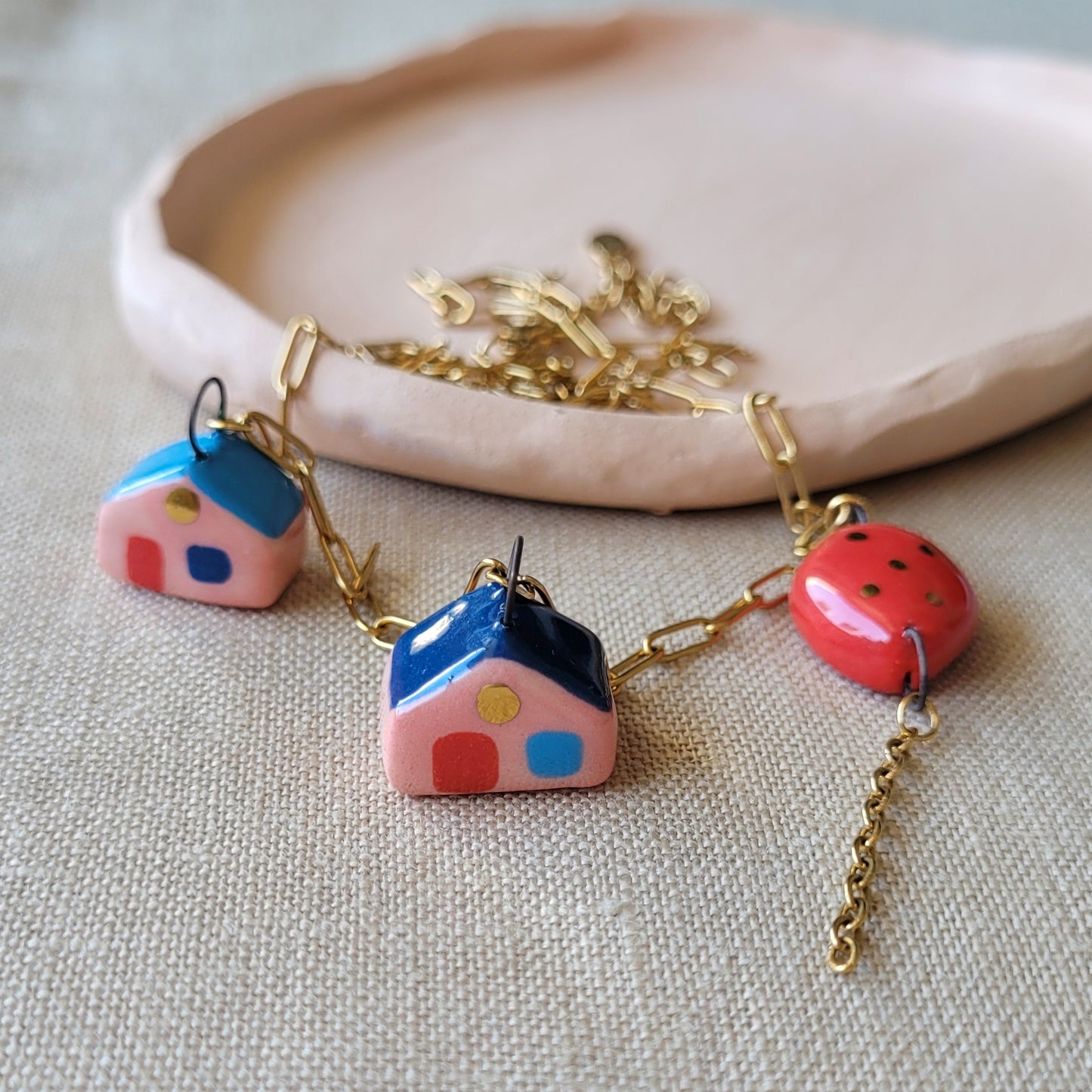 Porcelain necklace with gold "Two houses and red balloon"