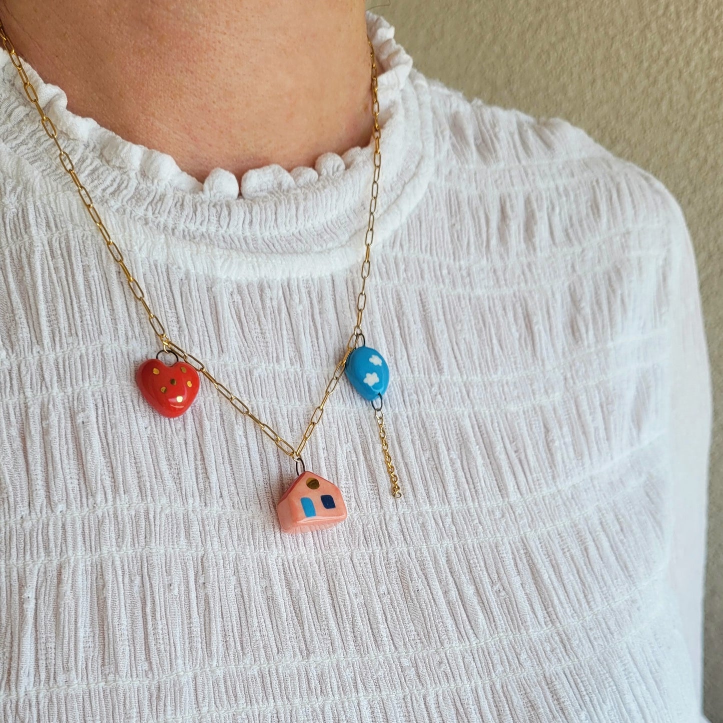 Porcelain necklace with gold "House, heart and balloon"