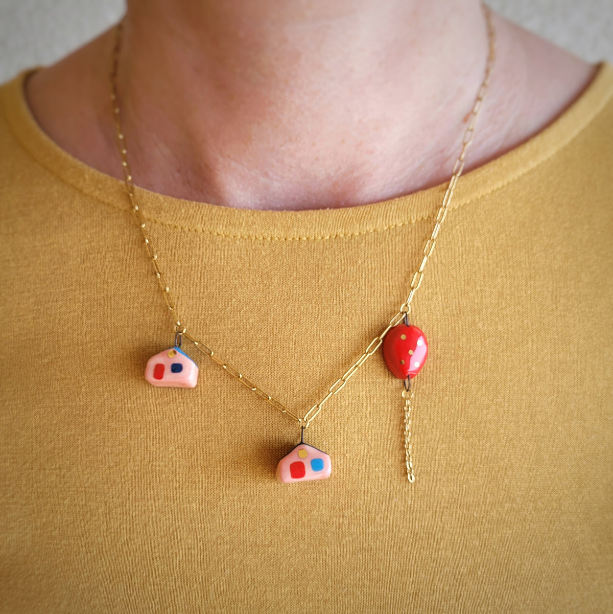 Porcelain necklace with gold "Two houses and red balloon"
