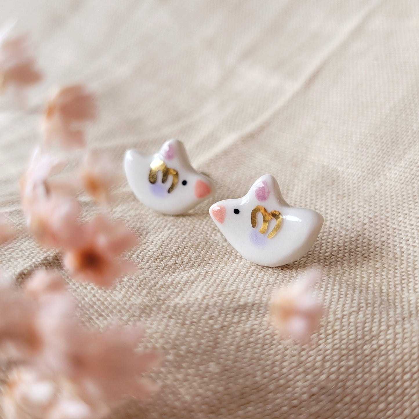 Porcelain stud earrings with gold "Tiny birds with purple and dark pink wings"