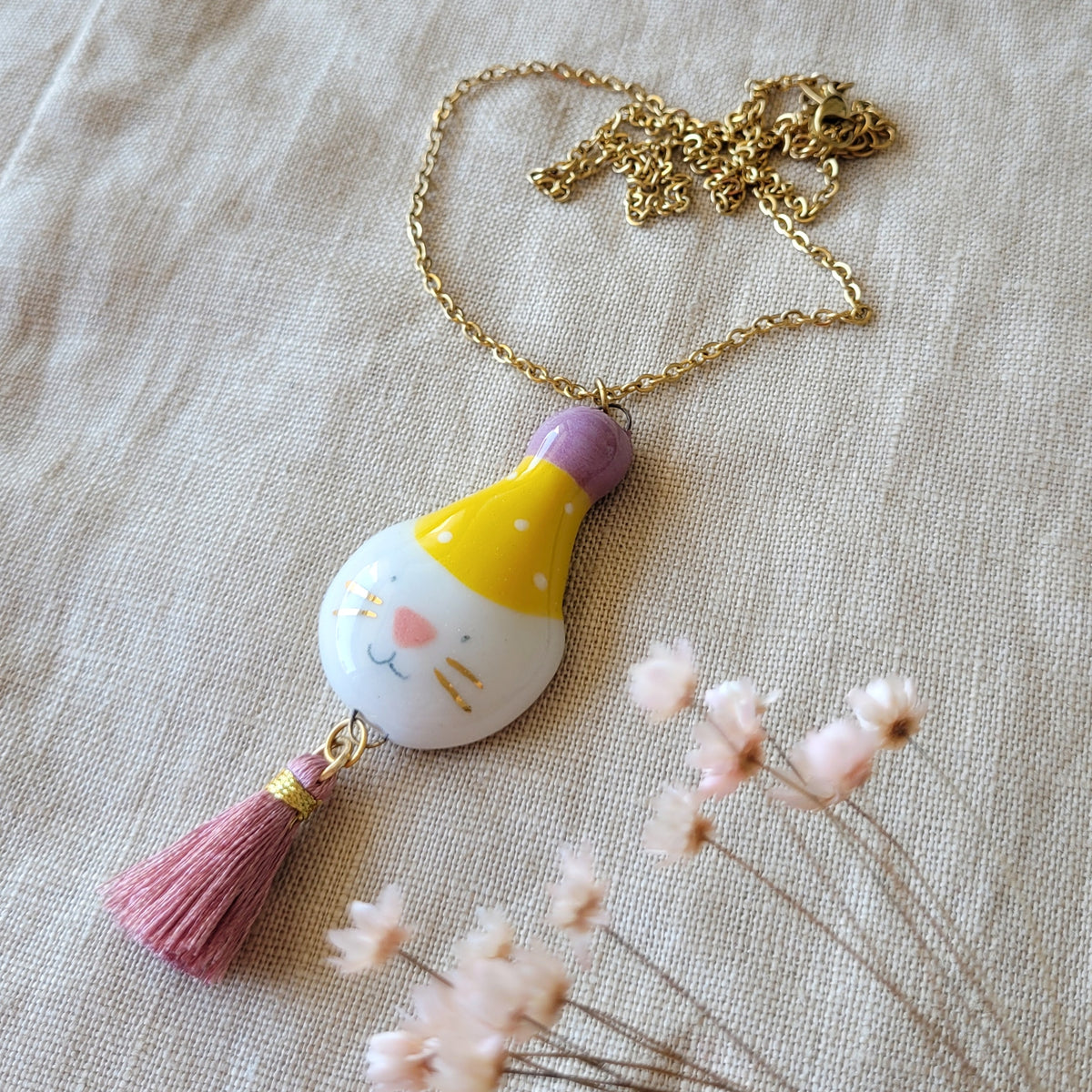 Porcelain necklace with gold "Big party kitty with yellow hat"