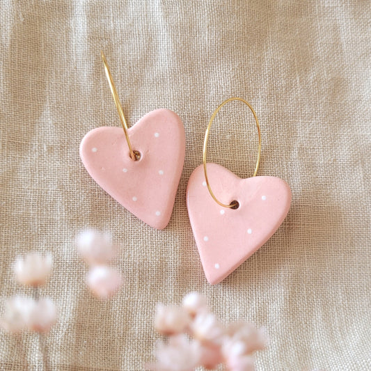 Ceramic dangle earrings "Pink hearts with white dots"