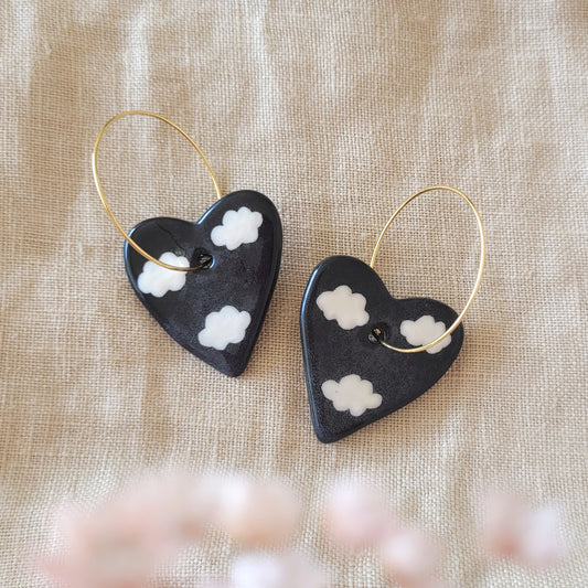 Ceramic dangle earrings "Black hearts with white clouds"