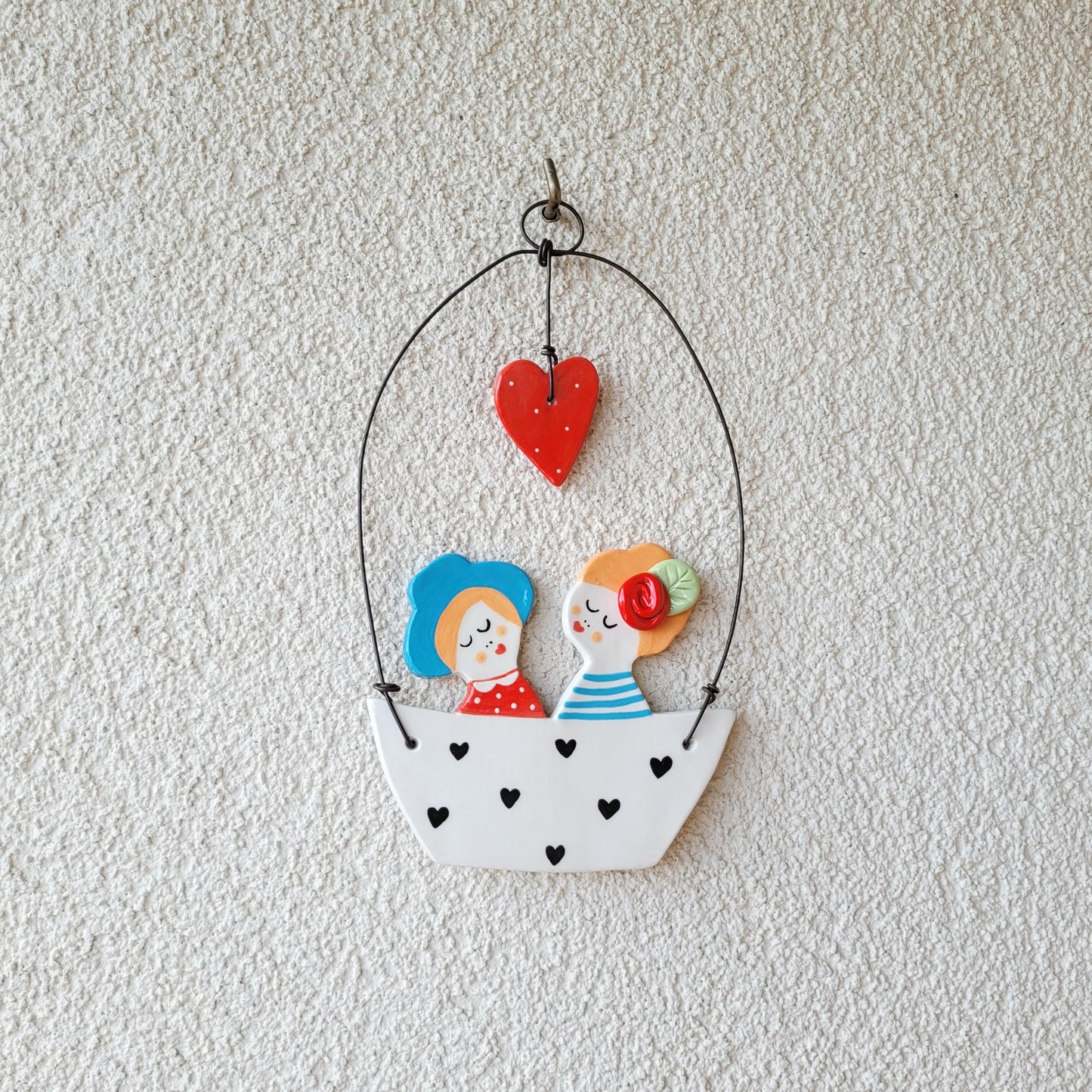 Ceramic wall hanging "Boy and girl in a white boat"