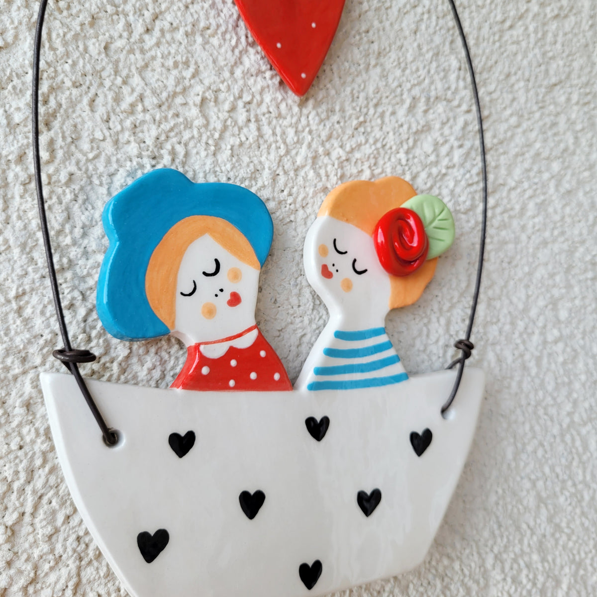 Ceramic wall hanging "Boy and girl in a white boat"