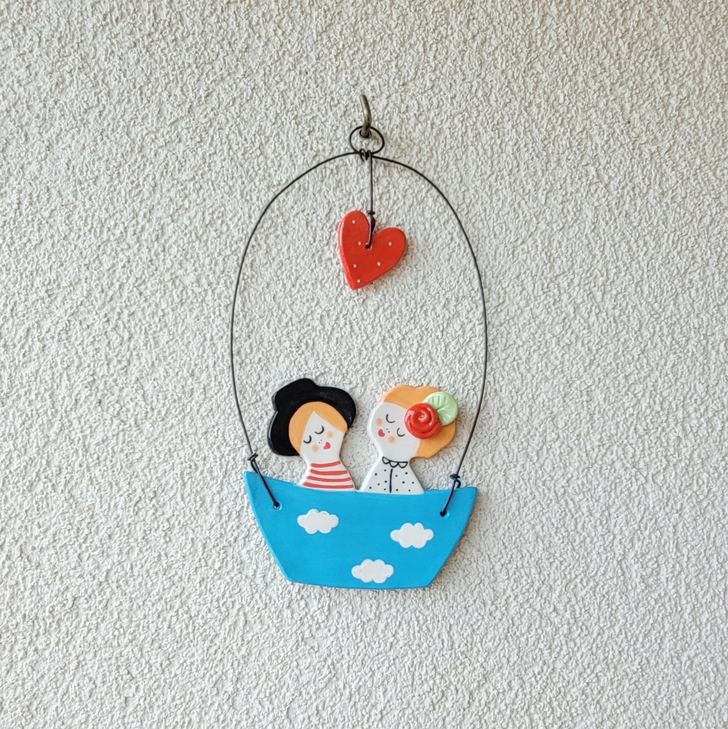 Ceramic wall hanging "Happy couple in a blue boat"