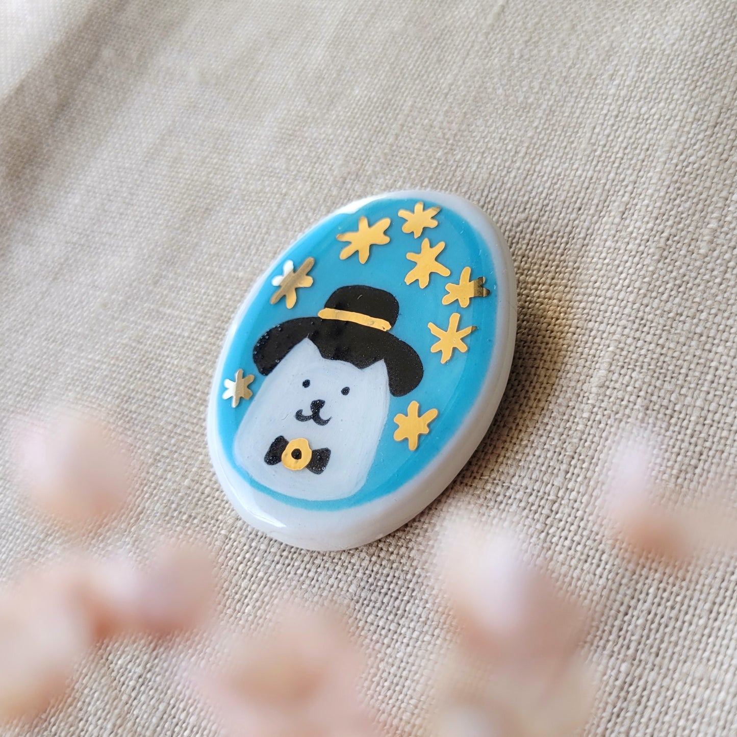 Porcelain brooch with gold "Mr. Cat"