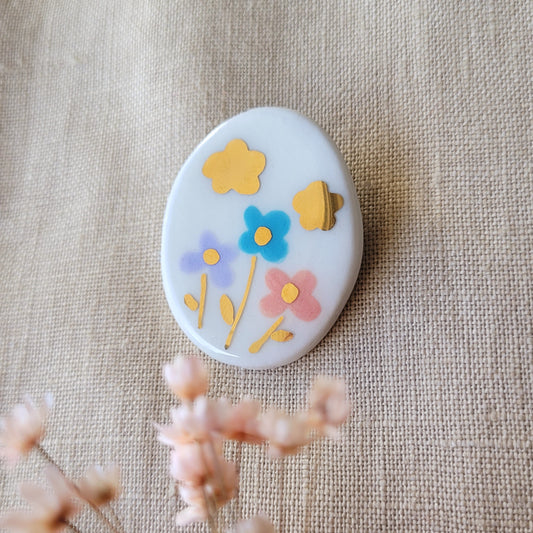 Porcelain brooch with gold "Flowers with golden cloud"