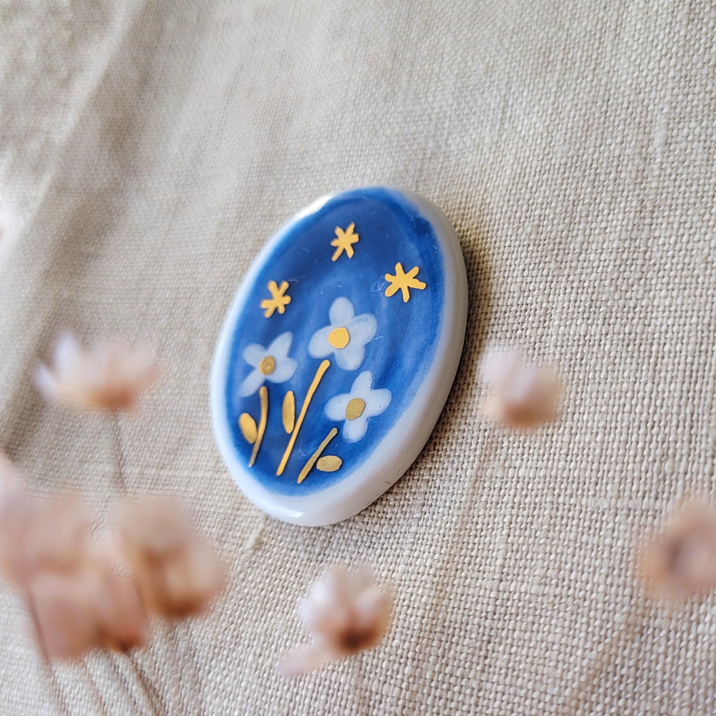 Porcelain brooch with gold "Starry night"
