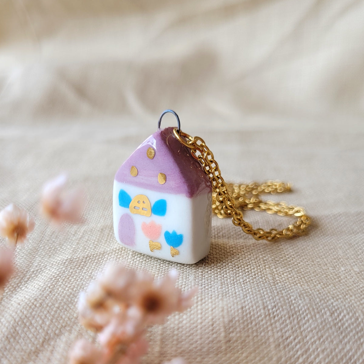 Porcelain necklace with gold "Dark pink house with blue window"