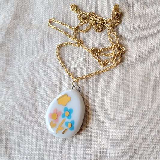 Porcelain necklace with gold "Two blue flowers and one pink"