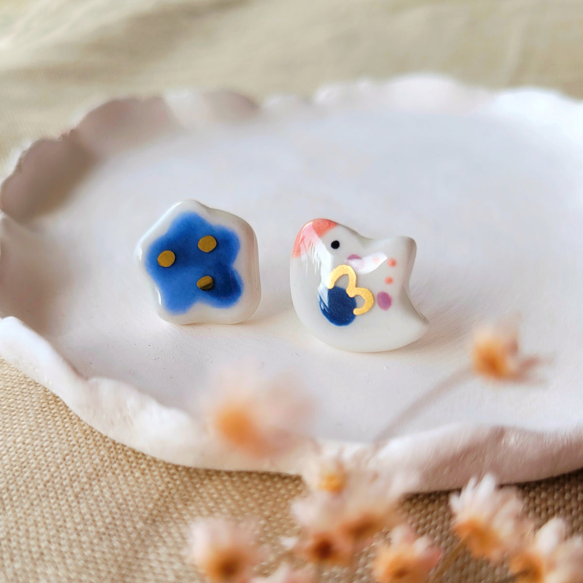 Porcelain stud earrings with gold "Little bird with dark blue cloud"