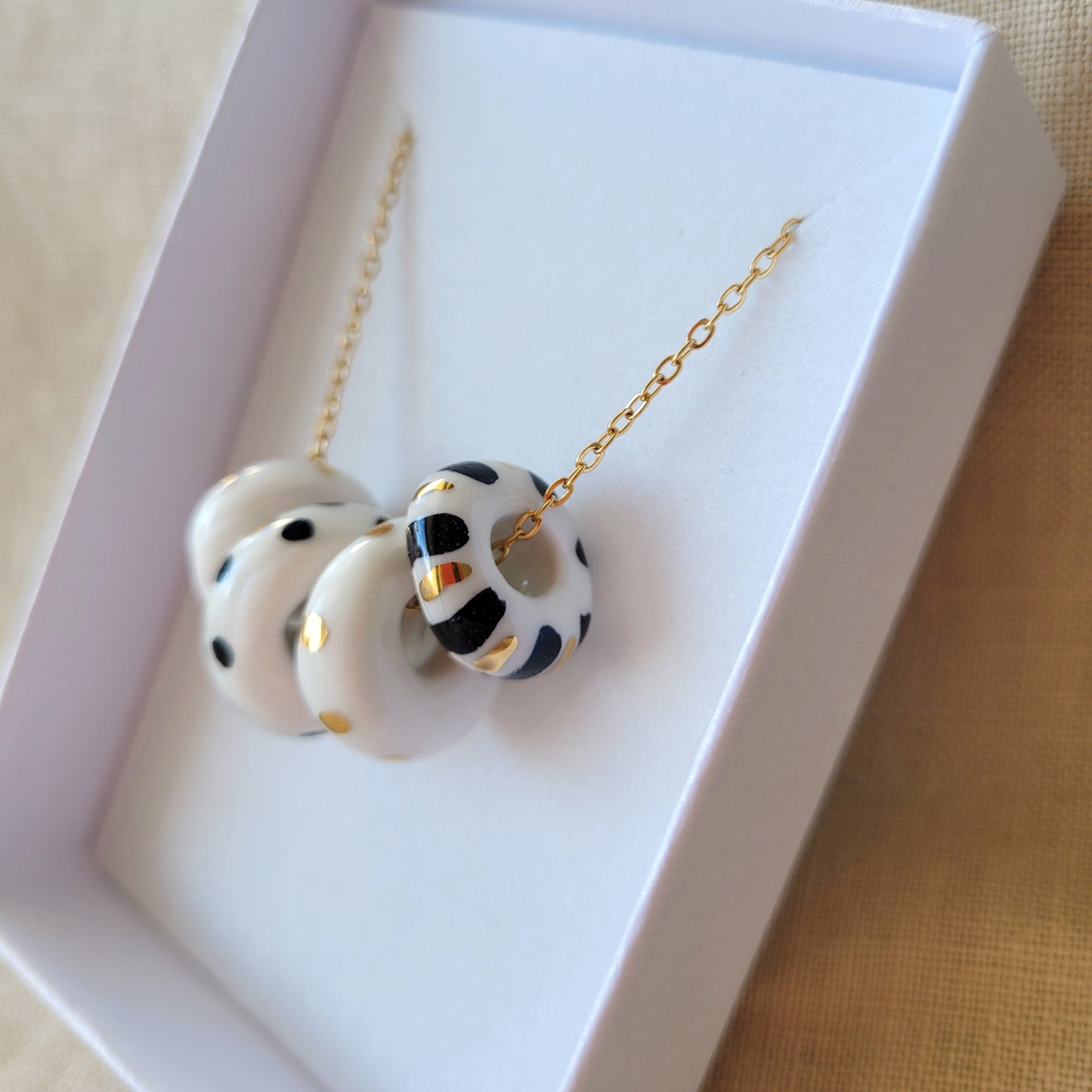 Porcelain necklace with gold "White, black and gold"