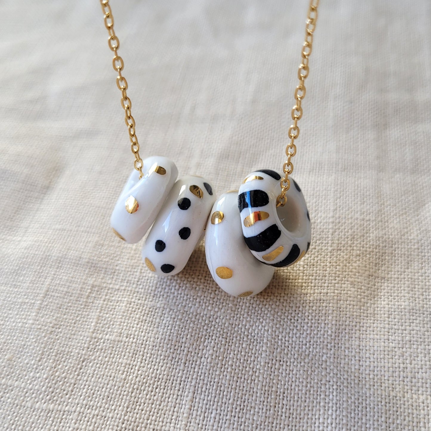Porcelain necklace with gold "White, black and gold"