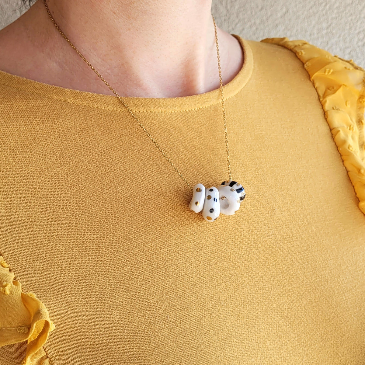 Porcelain necklace with gold "White, black and gold"