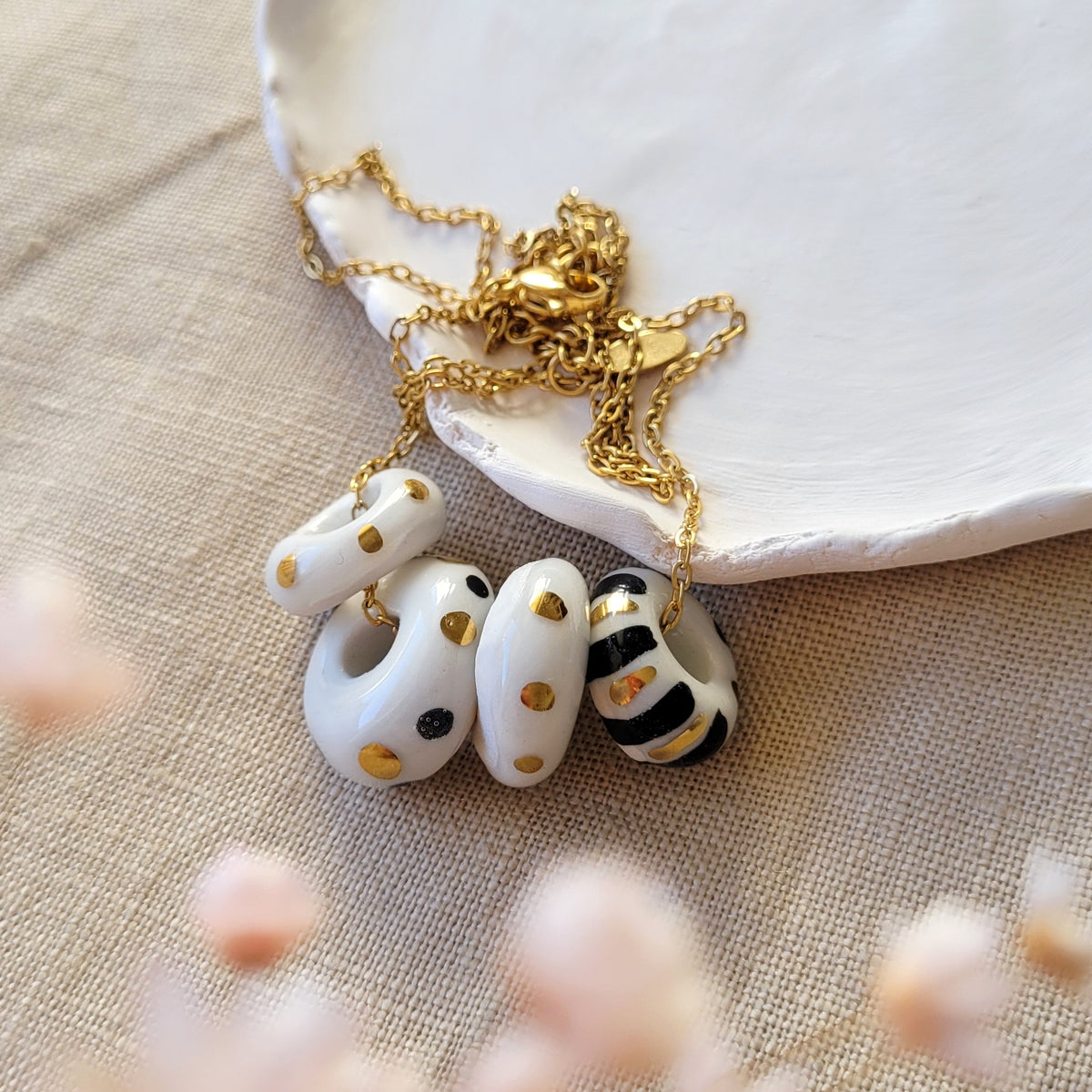 Porcelain necklace with gold "White, black and gold"