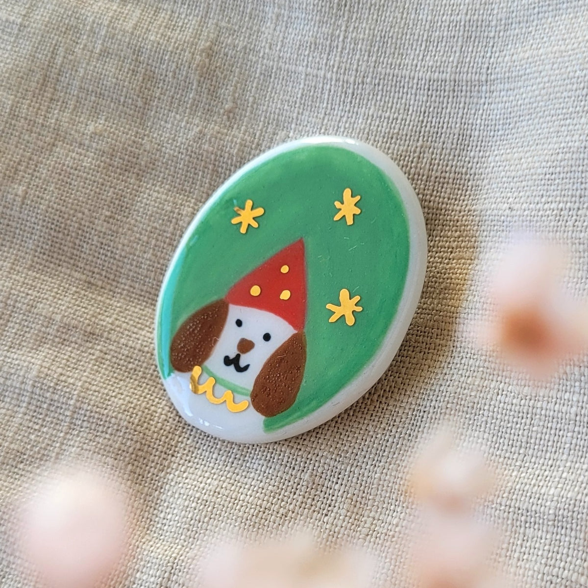 Porcelain brooch with gold "Bob"