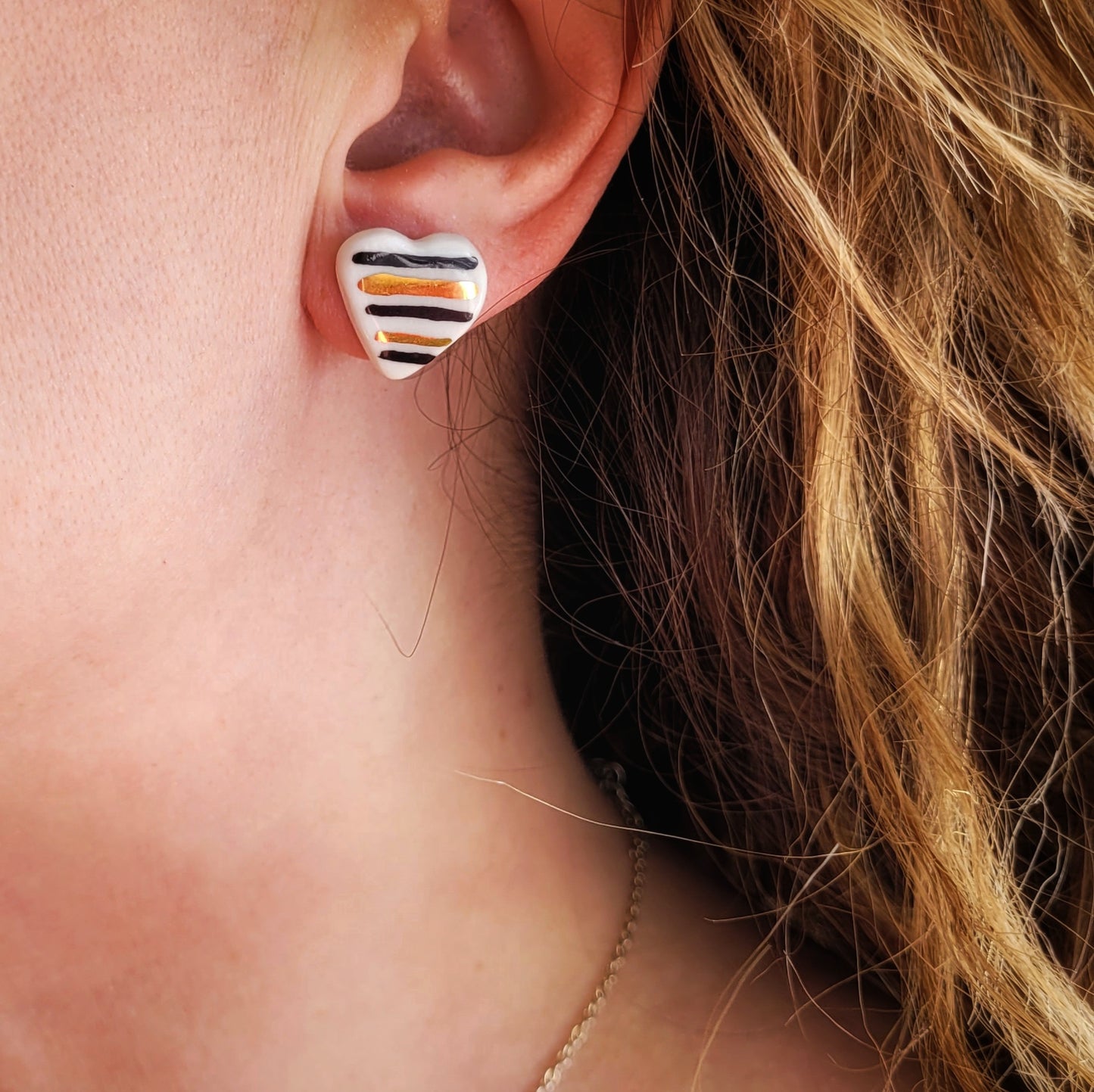 Porcelain stud earrings with gold "Hearts with black stripes"