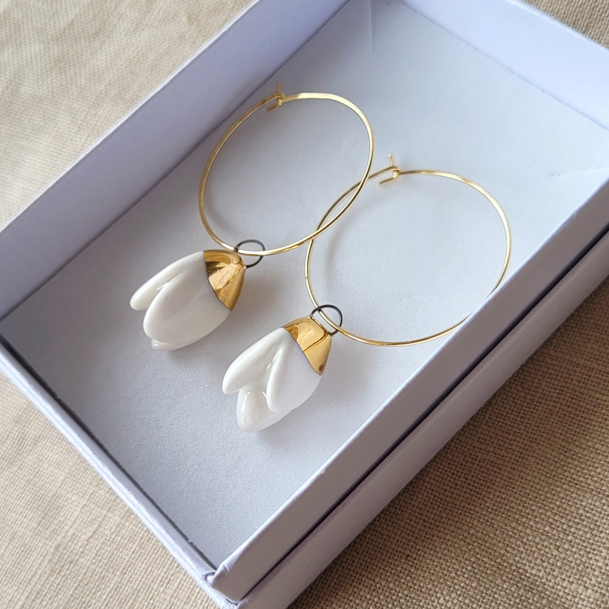Porcelain dangle earrings with gold "Snowdrops"