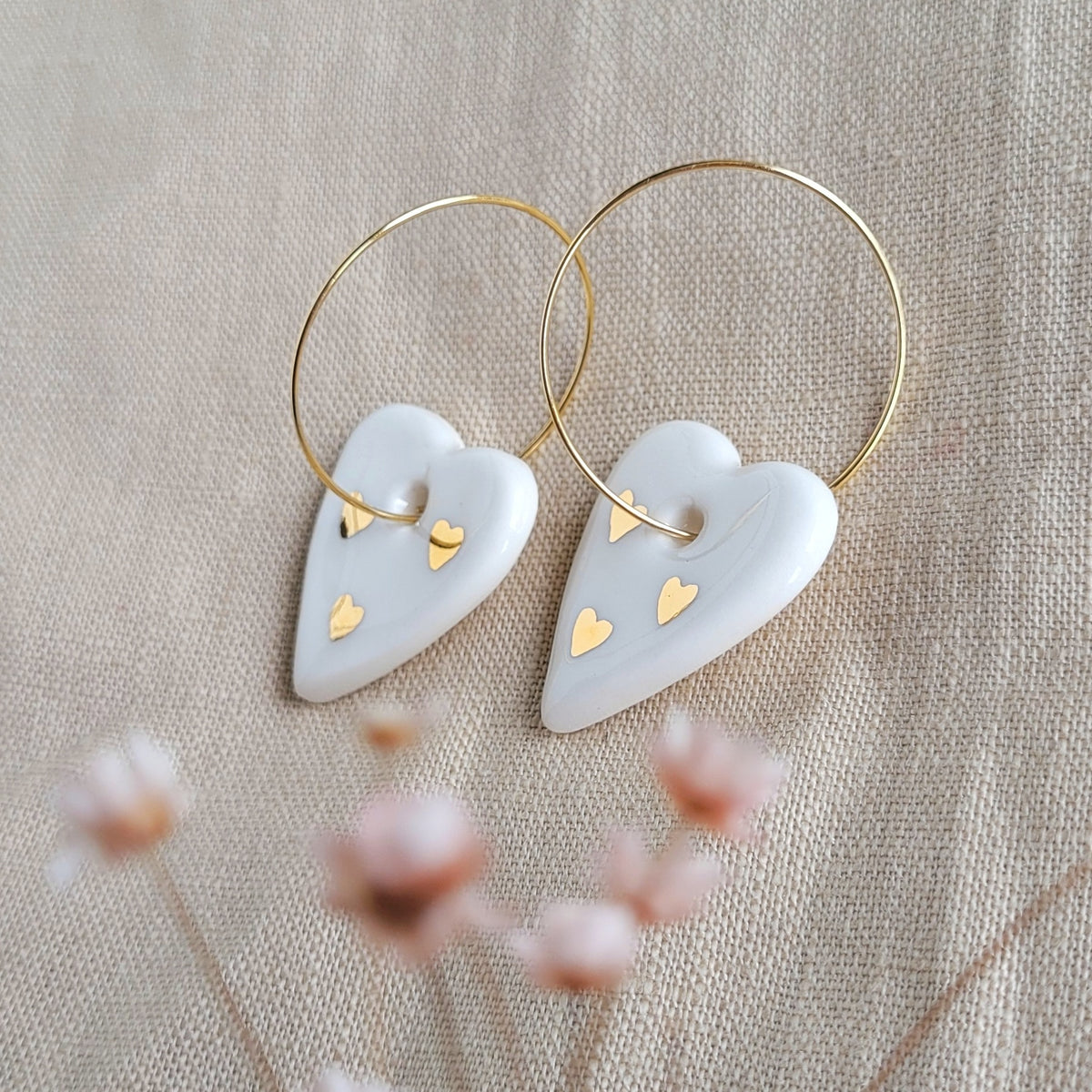 Porcelain dangle earrings with gold "White hearts"