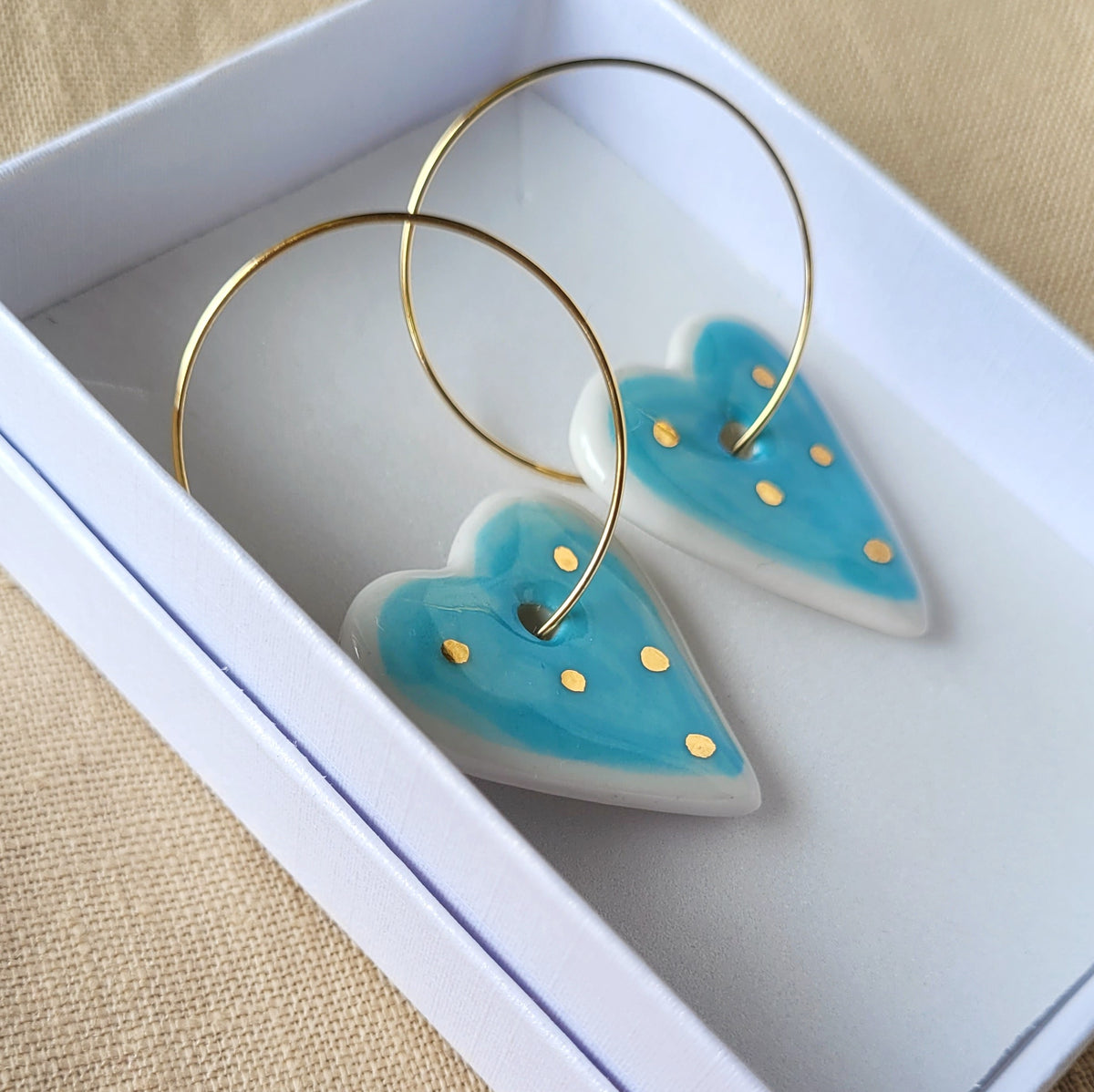 Porcelain dangle earrings with gold "White and blue hearts"