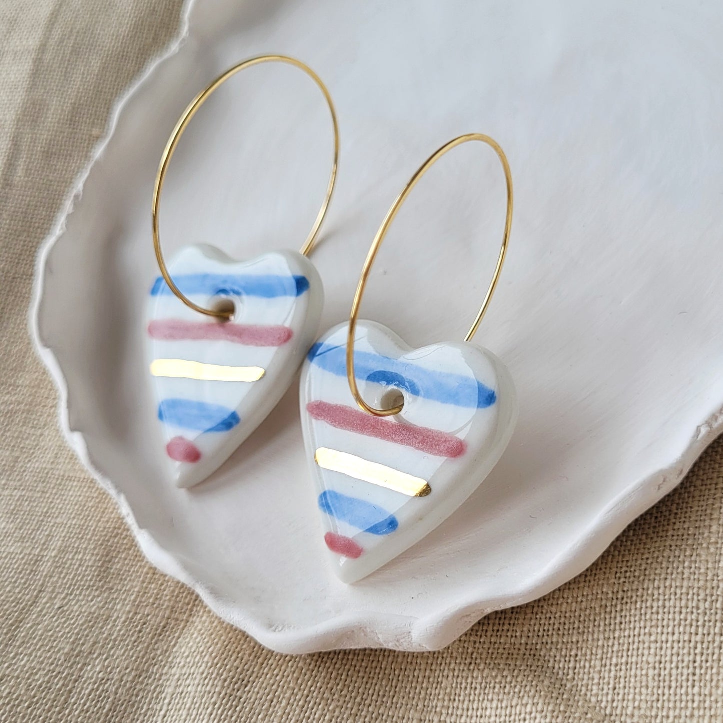 Porcelain dangle earrings with gold "White hearts with stripes"