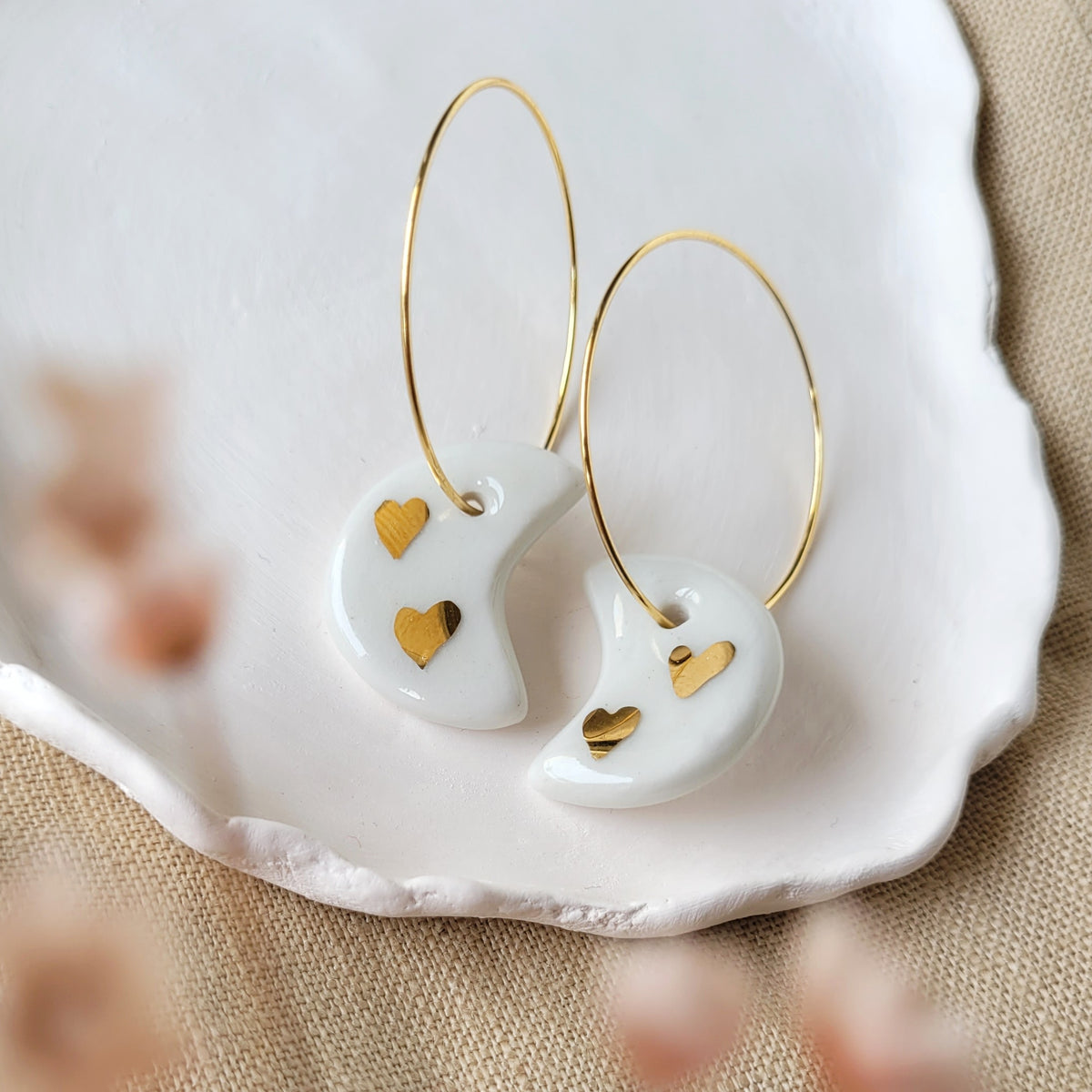 Porcelain dangle earrings with gold "White moons with little gold hearts"
