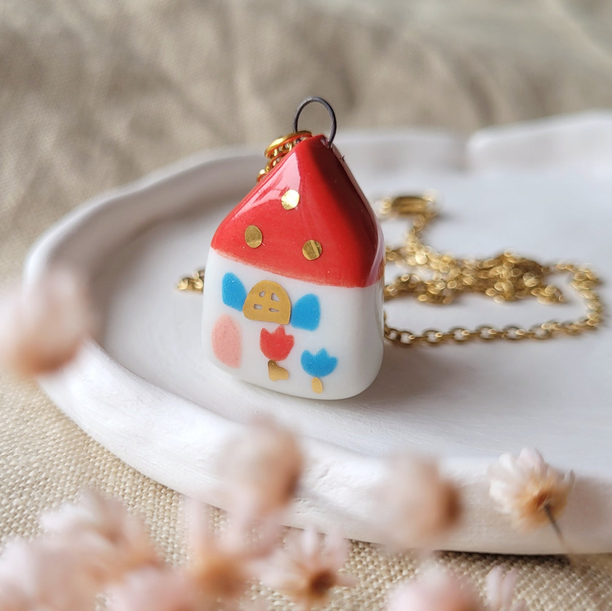 Porcelain necklace with gold "Red house with pink door"