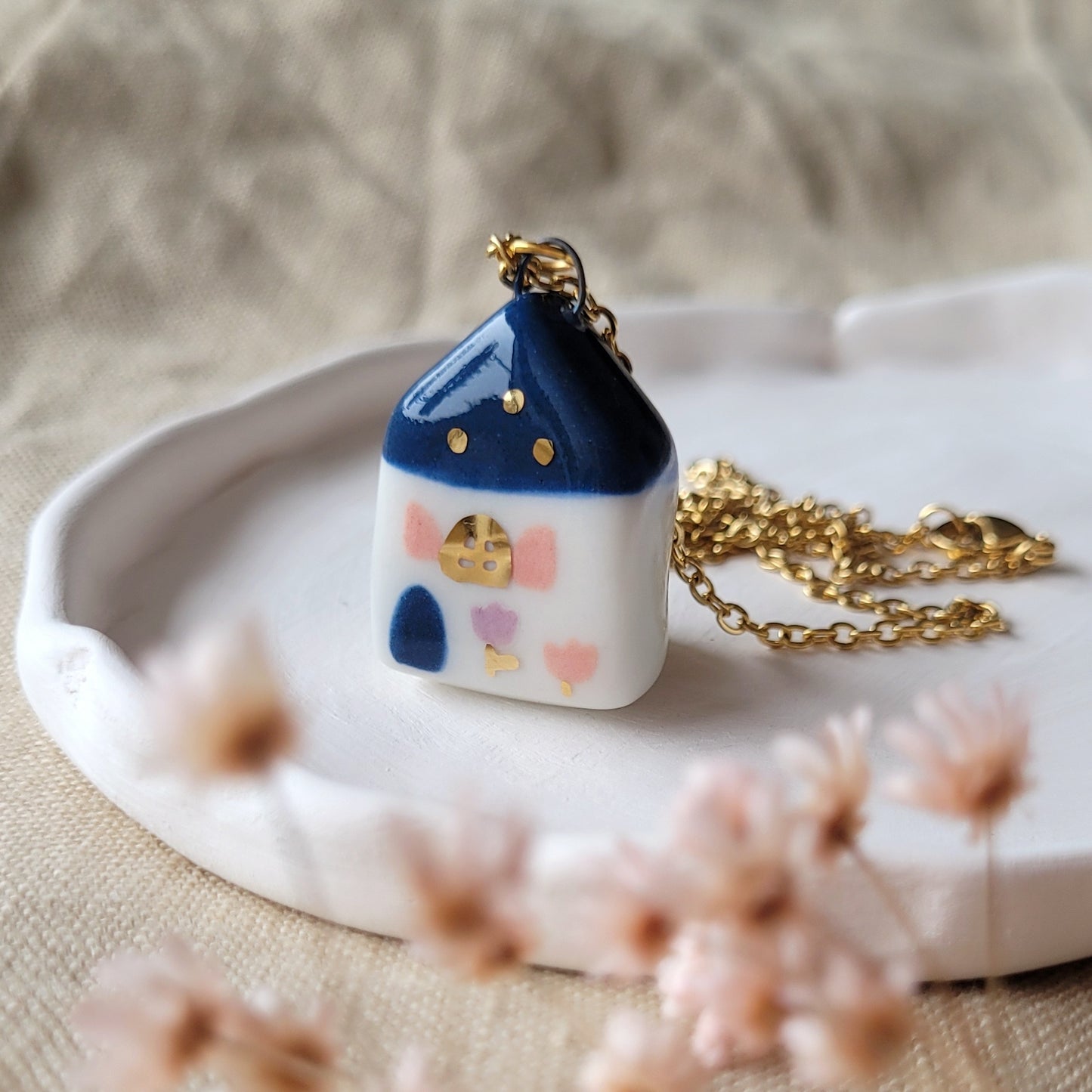 Porcelain necklace with gold "Dark blue house with pink window"